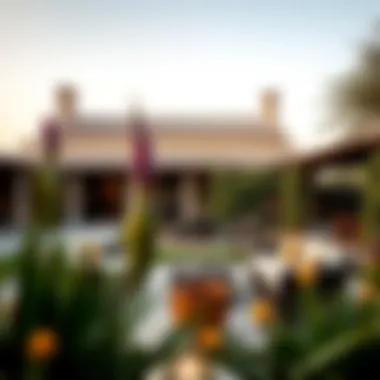 A serene outdoor space of a farmhouse with a beautiful garden and seating area