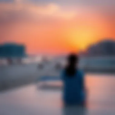 Sunset over JBR Beach with visitors relaxing on the shore