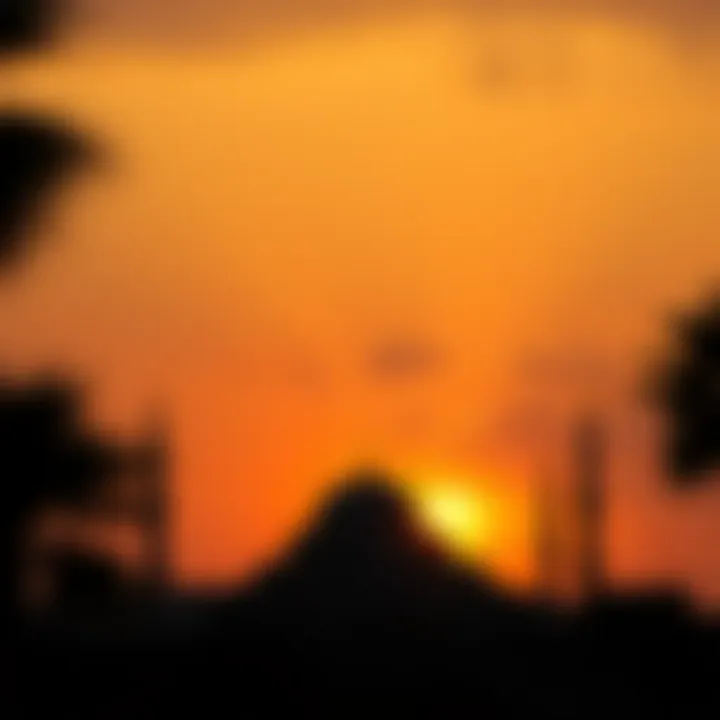 The majestic silhouette of a mosque against the Dubai skyline at sunset